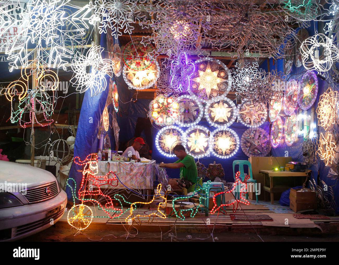 In this Dec. 9, 2017, photo, lantern makers work on traditional