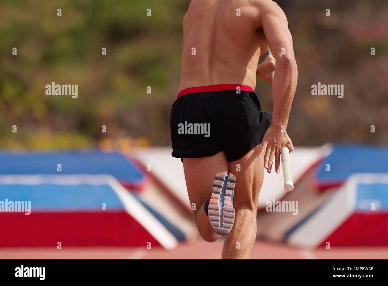 Man athlete performs the high jump pole vault Stock Photo Alamy