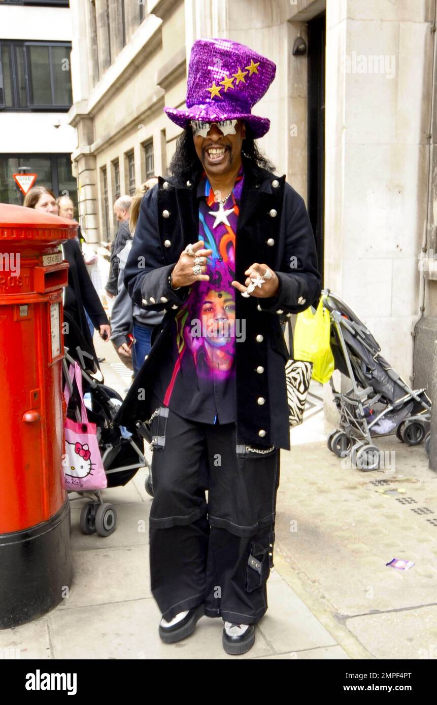 Always the flasy dresser, funk music legend Bootsy Collins wears a big purple, sequined hat, a