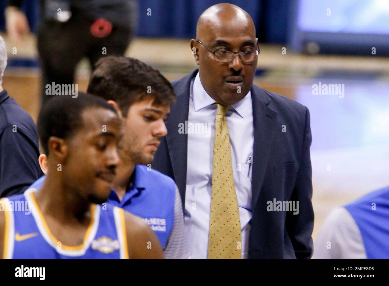 McNeese State head coach Dave Simmons right, walks off the dourt with his  team after losing to Pittsburgh in an NCAA college basketball game,  Saturday, Dec. 16, 2017, in Pittsburgh. Pittsburgh won
