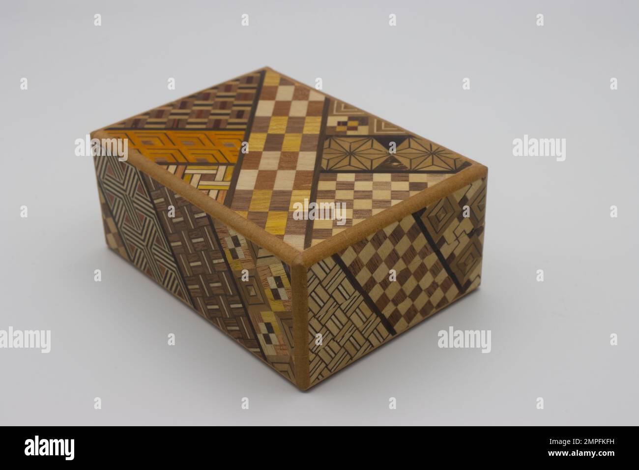 Puzzle japanese box. Wooden secret japanese box. It requires 11  moves in the correct order to be opened Stock Photo
