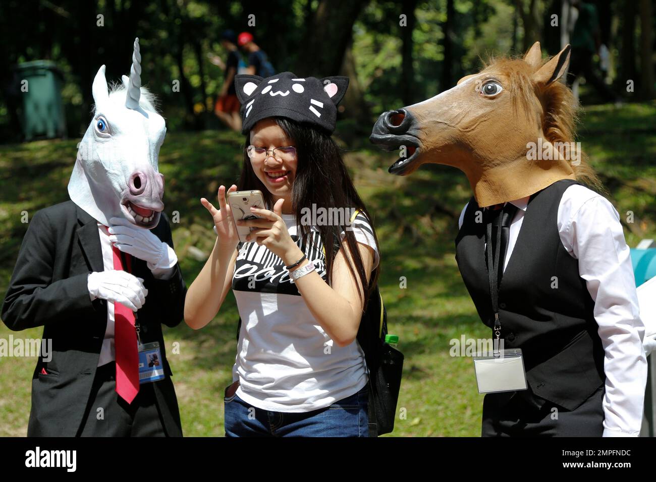 People take part in a cosplay event at Kuala Lumpur Convention Centre in Kuala Lumpur, Malaysia, Saturday, Dec. 16, 2017. Cosplay is short for Costume Play, a hobby where players wear costumes and accessories to resemble popular characters. (AP Photo/Sadiq Asyraf) Stock Photo