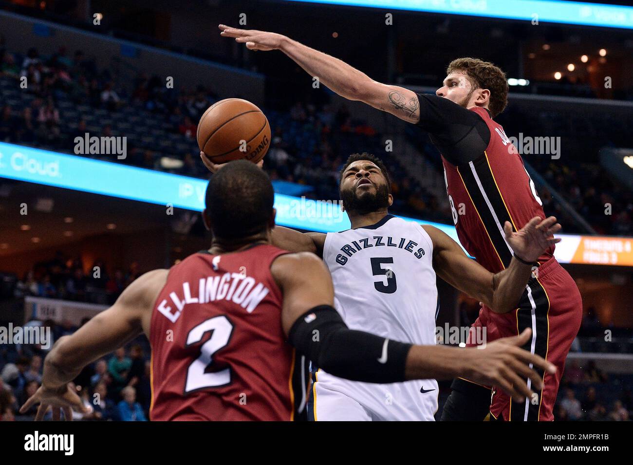 Memphis Grizzlies guard Andrew Harrison (5) shoots between Miami Heat