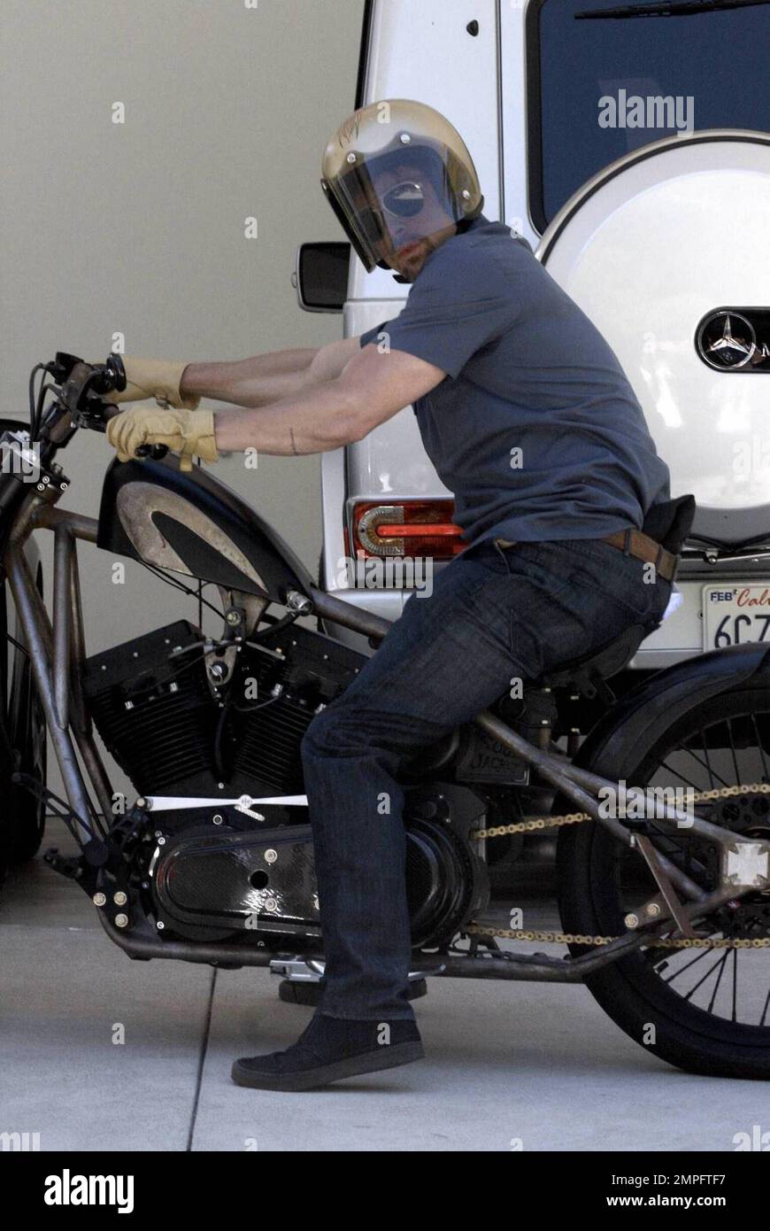 Superstar Brad Pitt gets geared up inside a friend s home before