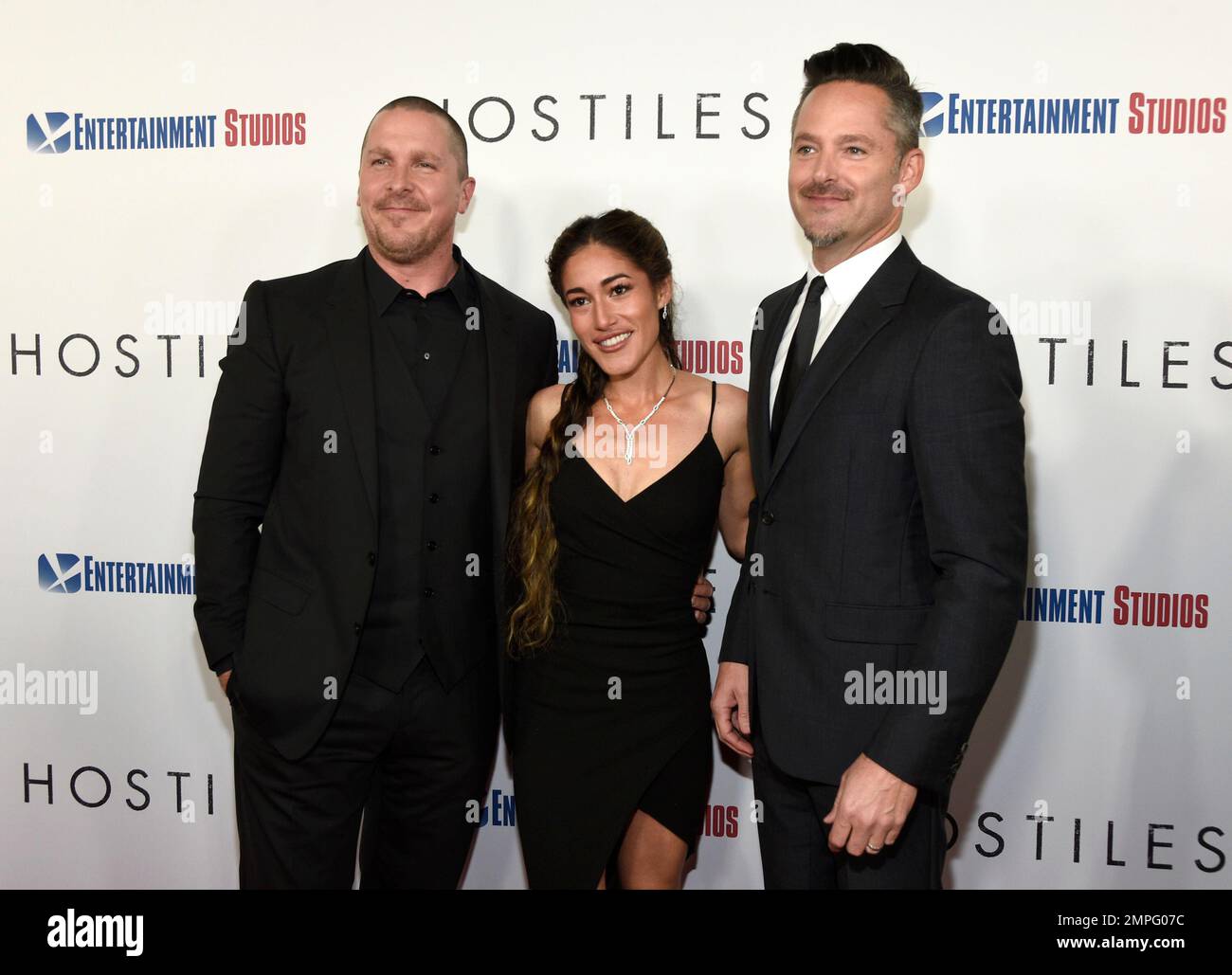 Christian Bale, from left, Q'orianka Kilcher and director Scott Cooper