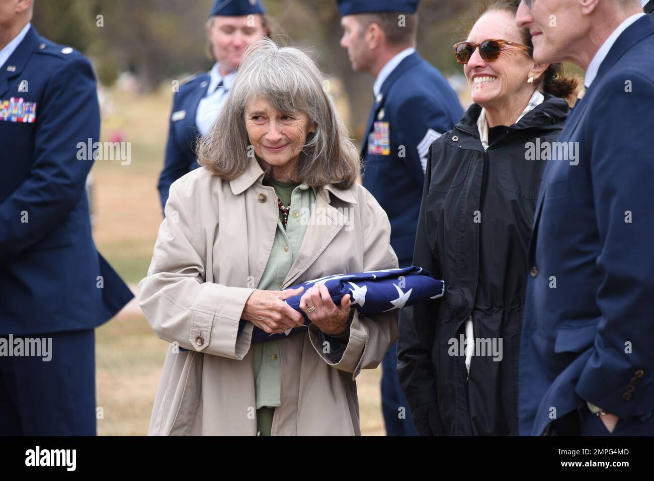 Mary Page of Denver, Colo., daughter of former 185th Fighter Group Commander Col. Warren Nelson, holds a U.S. flag that was presented to her at the funeral of her father  in Sioux City, Iowa on October 14, 2022. Nelson was the last World War II veteran to serve as 185th Commander when he retired in 1980, he passed away this week at the age of 97. U.S. Air National Guard photo Senior Master Sgt. Vincent De Groot 185th ARW Wing PA Stock Photo