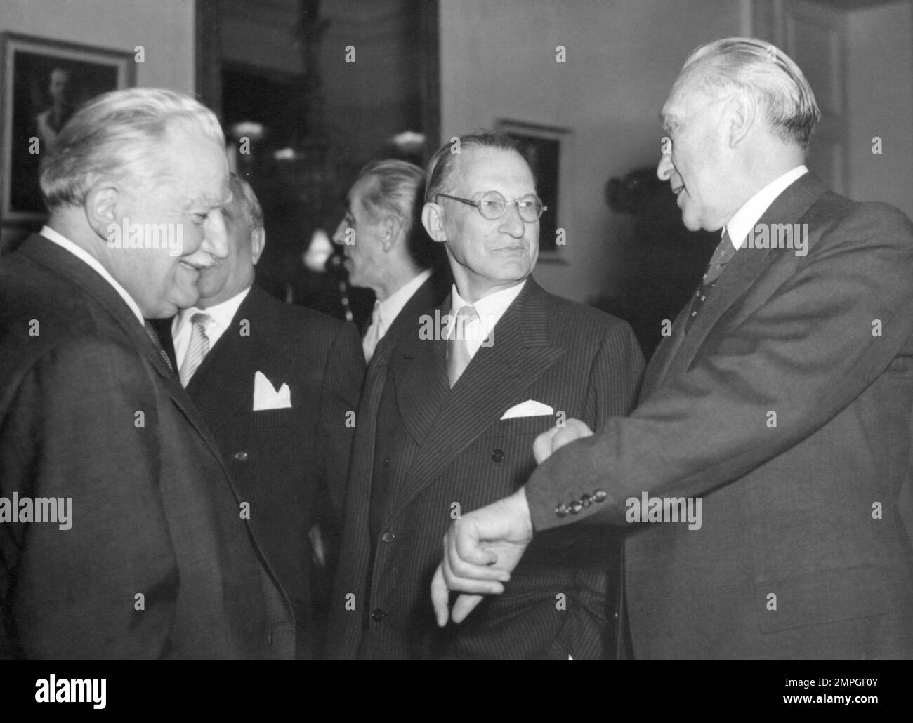 Joseph Bech, Luxembourg Foreign Minister, checks the time shown by West ...