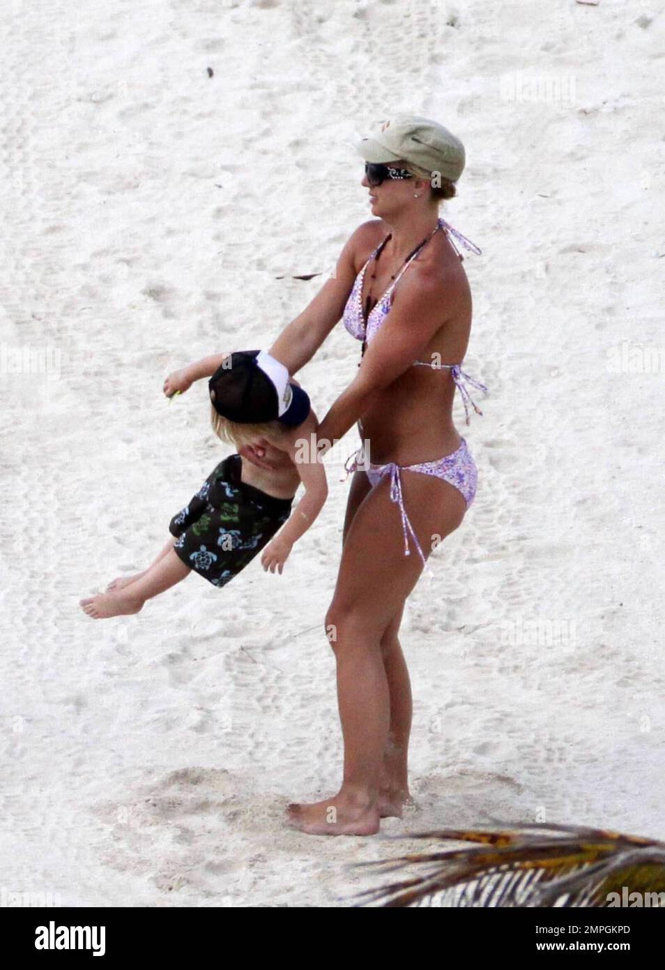 Exclusive!! Popstar Britney Spears looks in great shape on the beach in a  pink bikini as she enjoys day two of a long deserved vacation following the  North American leg of her