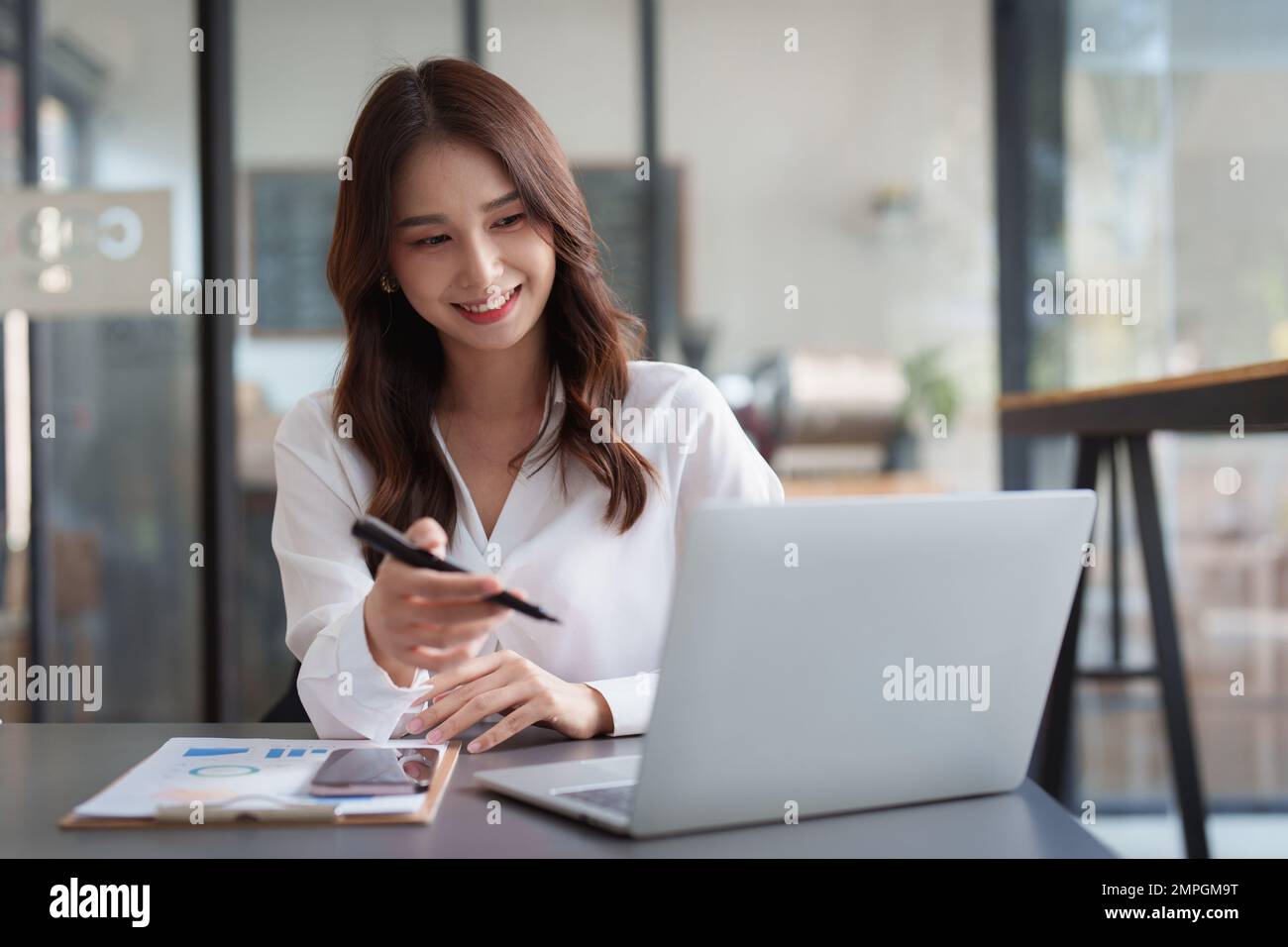 Portrait of business accountant using laptop for analyze financial data. finance, tax, accounting concept Stock Photo