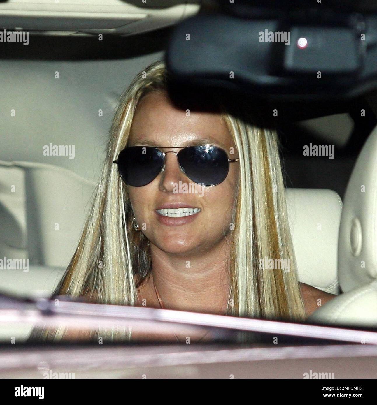 Britney Spears went to the B2V hair salon today and emerged a few hours  later with a sleek new mane of blonde hair with various tinted stripes in  it. West Hollywood, Ca.