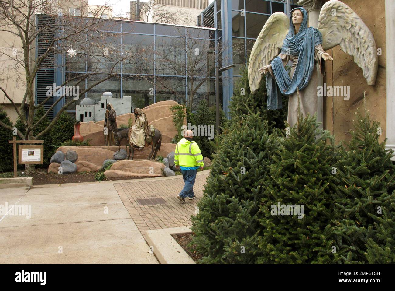 In this Dec. 5, 2017 photo, a worker walks past part of a display of