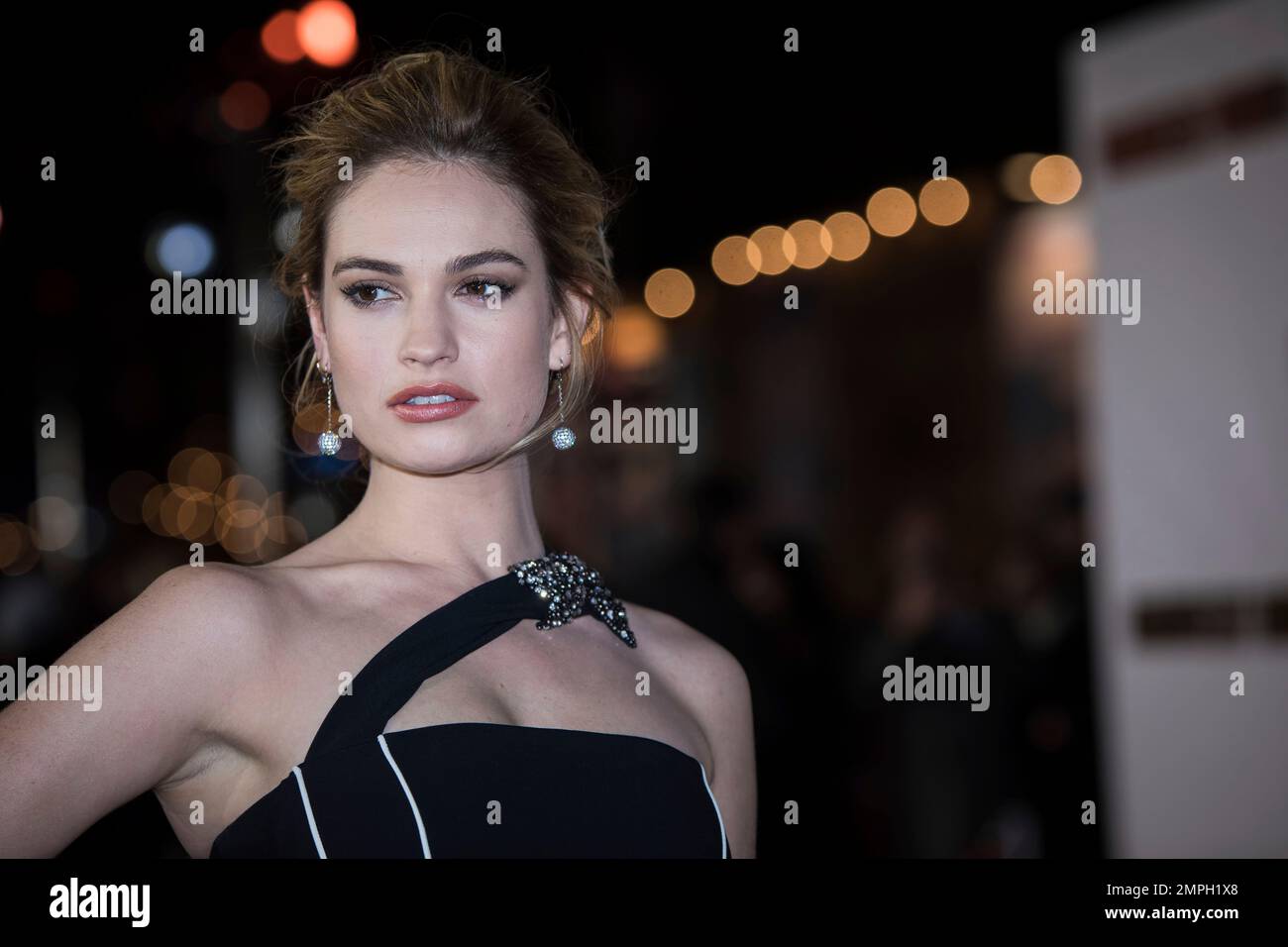 Actress Lily James poses for photographers upon arrival at the premiere of the film 'Darkest