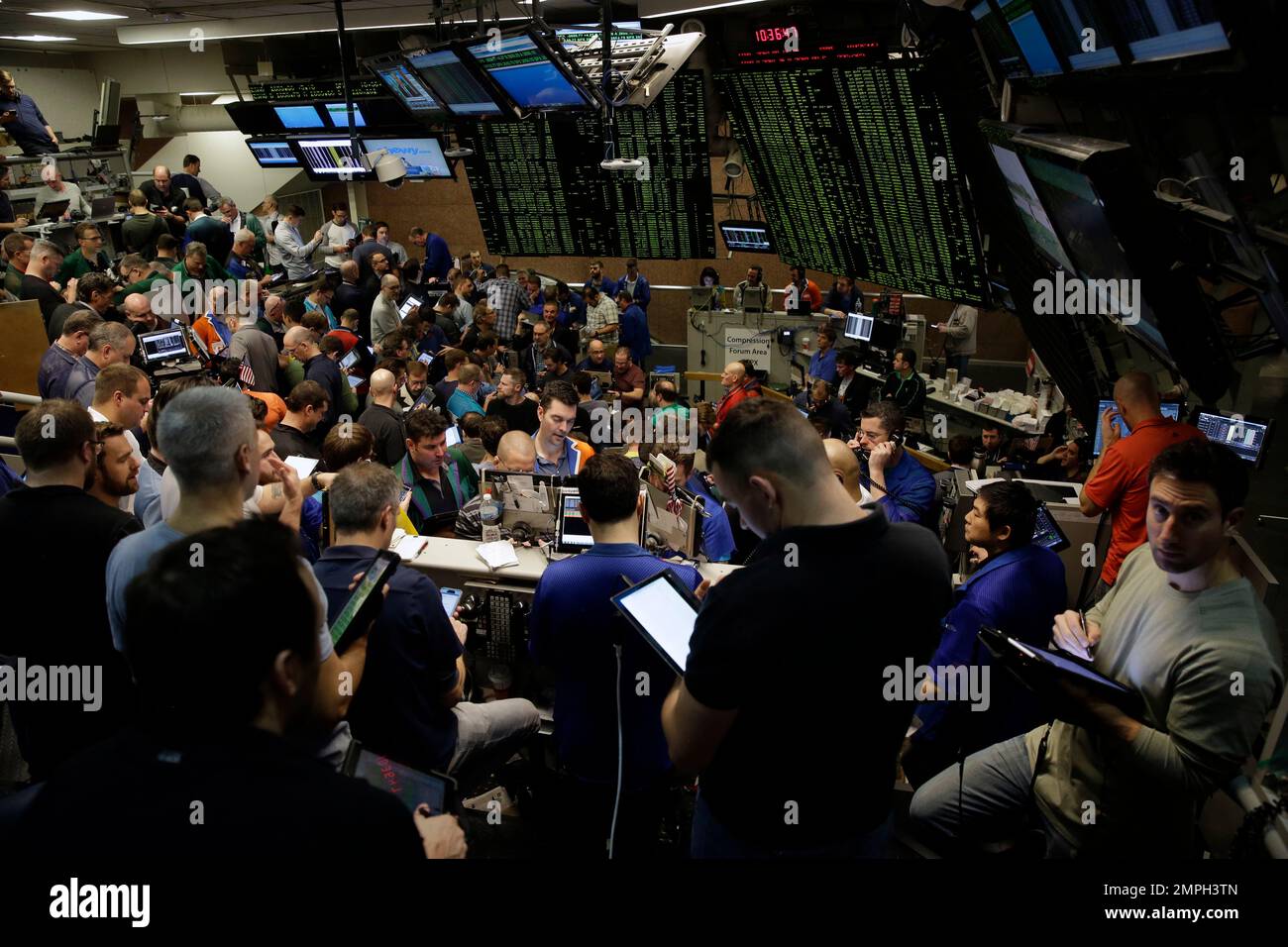 Traders work in a trading pit at the Chicago Board Options Exchange,  Monday, Dec. 11, 2017, in Chicago, as they trade S&P 500 Options, unrelated  to bitcoin futures. Trading in Bitcoin futures