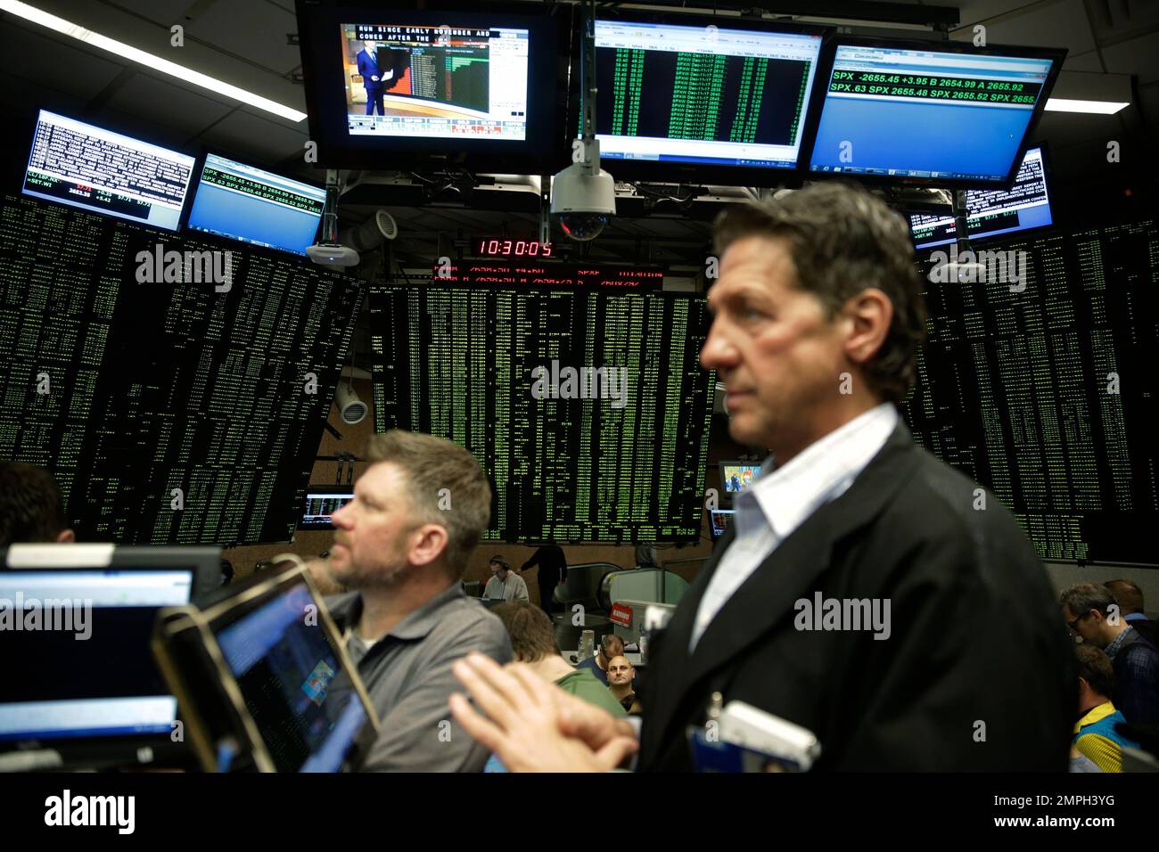 Traders work in a trading pit at the Chicago Board Options Exchange,  Monday, Dec. 11, 2017, in Chicago, as they trade S&P 500 Options, unrelated  to bitcoin futures. Trading in Bitcoin futures