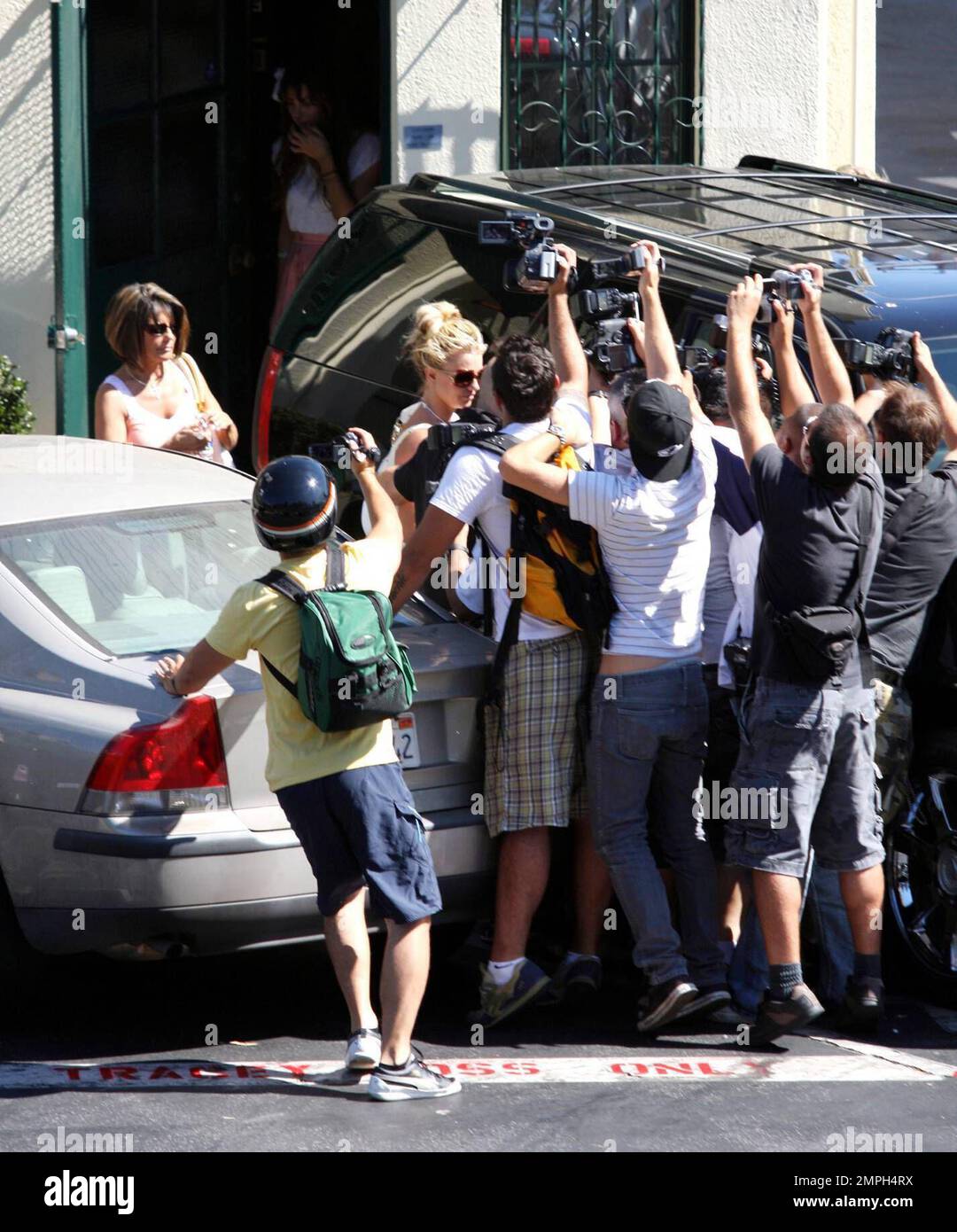 Britney Spears gets mobbed by photographers as she leaves the back 