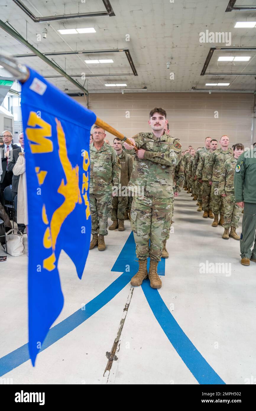U.S. Air Force Airman 1st Class Gabriel Garcia, a maintenance administrator assigned to the Ohio National Guard’s 180th Fighter Wing, holds the 180FW Maintenance Group flag during a Change of Command ceremony at the 180FW in Swanton, Ohio, Oct. 15, 2022. During the ceremony, outgoing 180FW commander, Col. Michael DiDio, relinquished command to incoming commander, Col. Chad Holesko. Stock Photo
