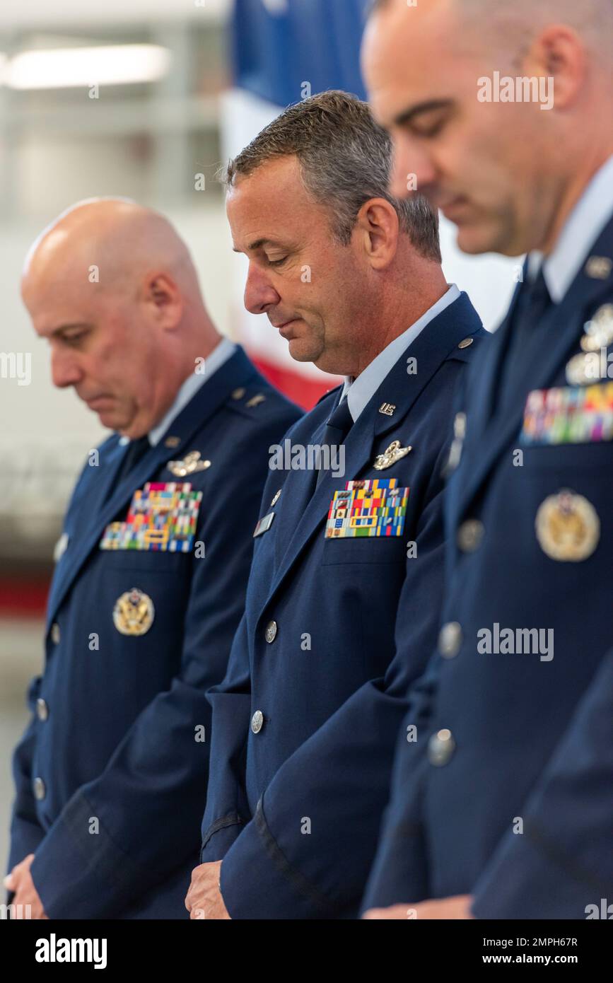 U.S. Air Force Col. Michael DiDio, outgoing commander of the Ohio National Guard’s 180th Fighter Wing, bows his head in prayer during a Change of Command ceremony at the 180FW in Swanton, Ohio, Oct. 15, 2022. During the ceremony, outgoing 180FW commander, DiDio, relinquished command to incoming commander, Col. Chad Holesko. Stock Photo