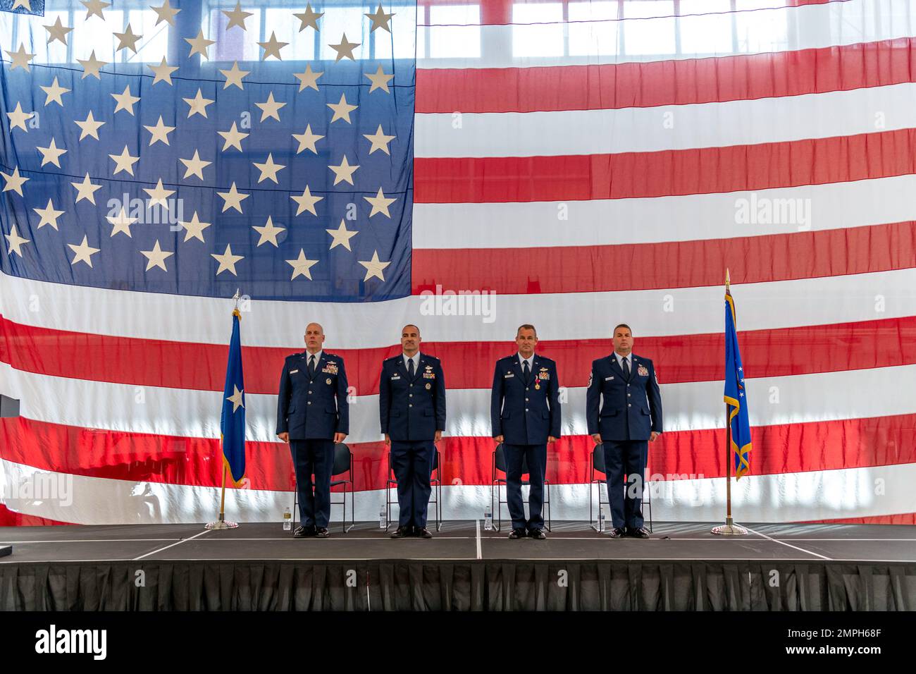 U.S. Air Force Brig. Gen. Gary McCue, Deputy Assistant Adjutant General for Air, Ohio National Guard, Col. Chad Holesko, incoming commander of the Ohio National Guard’s 180th Fighter Wing, Col. Michael DiDio, outgoing 180FW Commander and Chief Master Sgt. Daniel Baumert, Command Chief, 180FW, stand at attention during a Change of Command ceremony at the 180FW in Swanton, Ohio, Oct. 15, 2022. During the ceremony, outgoing 180FW commander, DiDio, relinquished command to incoming commander, Holesko. Stock Photo