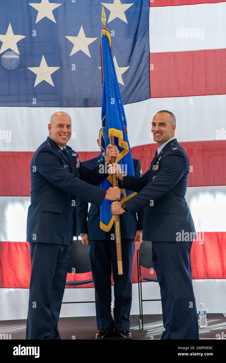 U.S. Air Force Col. Chad Holesko receives the official 180th Fighter Wing flag, officially assuming command of the wing from Brig. Gen. Gary McCue, Deputy Assistant Adjutant General for Air, Ohio National Guard, during a Change of Command ceremony at the 180FW in Swanton, Ohio, Oct. 15, 2022. During the ceremony, outgoing 180FW commander, Col. Michael DiDio, relinquished command to incoming commander, Holesko. Stock Photo
