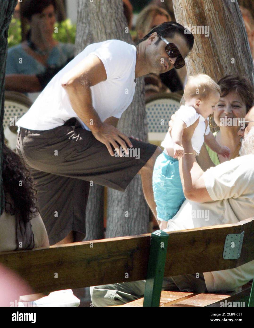 Exclusive!! Brooke Burke, David Charvet and 6-month-old daughter, Heaven Rain, spend the day in Malibu with what appears to be two doting grandparents. Charvet was a hands-on dad, holding his daughter for most of the family lunch and pushing the stroller. Malibu, Calif. 8/5/07. Stock Photo