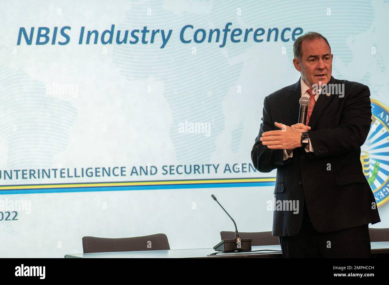 MCLEAN, Va. (Oct. 18, 2022) - William Lietzau, Defense Counterintelligence and Security Agency (DCSA) director, welcomes personnel and facility security professionals from industry to the 2022 National Background Investigation Services (NBIS) Industry Conference. DCSA leaders and NBIS experts briefed cleared industry on NBIS program status; the impact on industry's feedback and partnership with DCSA; and onboarding requirements. NBIS is the backbone of the Trusted Workforce 2.0 whole-of-government background investigation reform effort overhauling the personnel vetting process by creating one Stock Photo