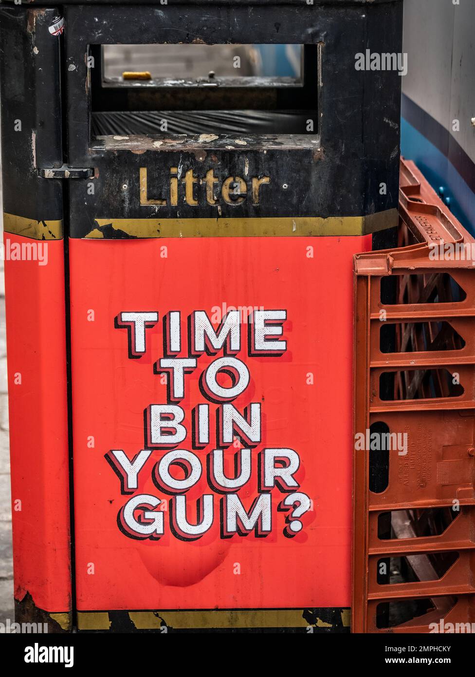 Waste Bin in Central London with Time To Bin Your Gum? displayed on the side of the bin Stock Photo