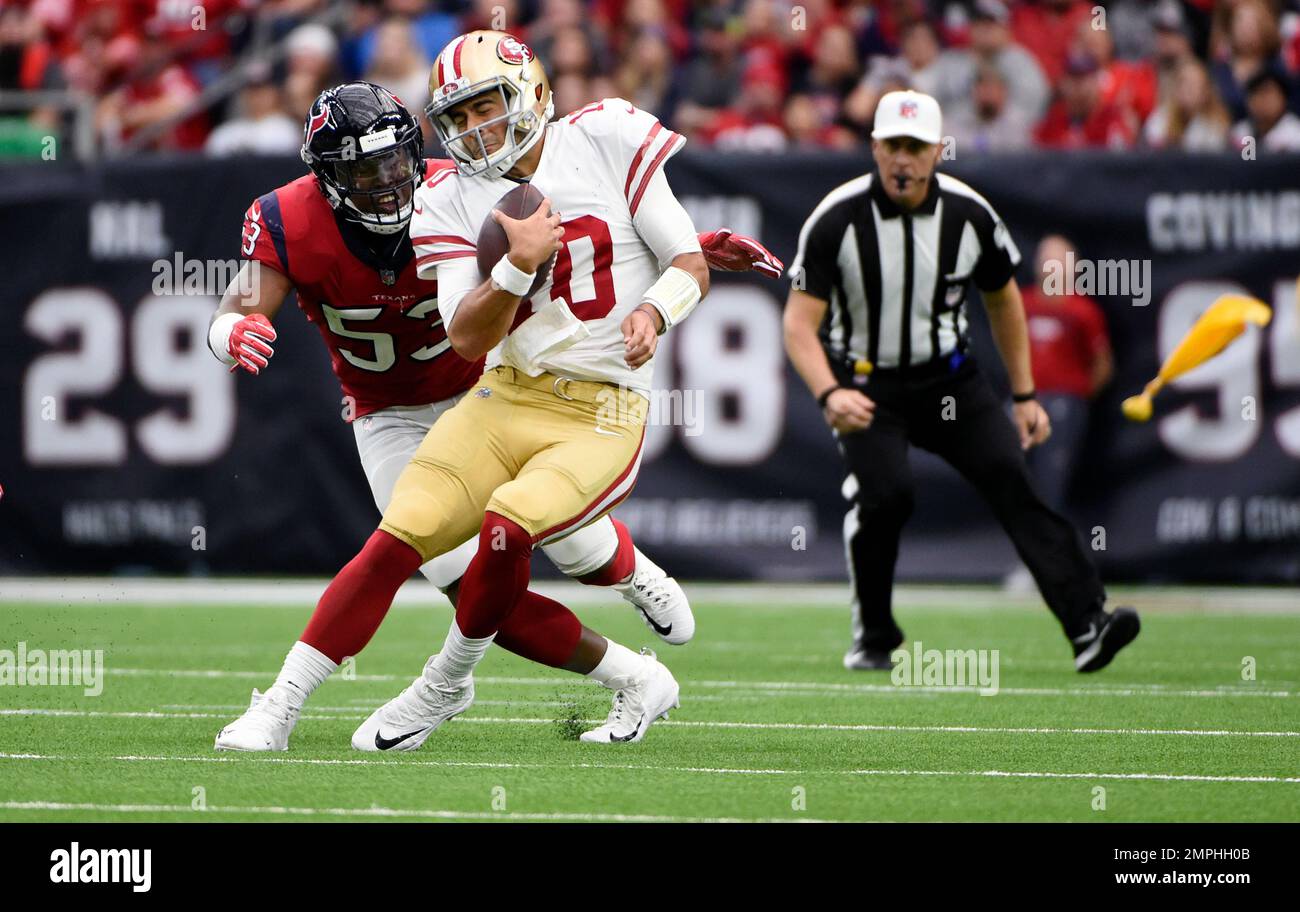 San Francisco 49ers quarterback Jimmy Garoppolo (10) is hit by Houston