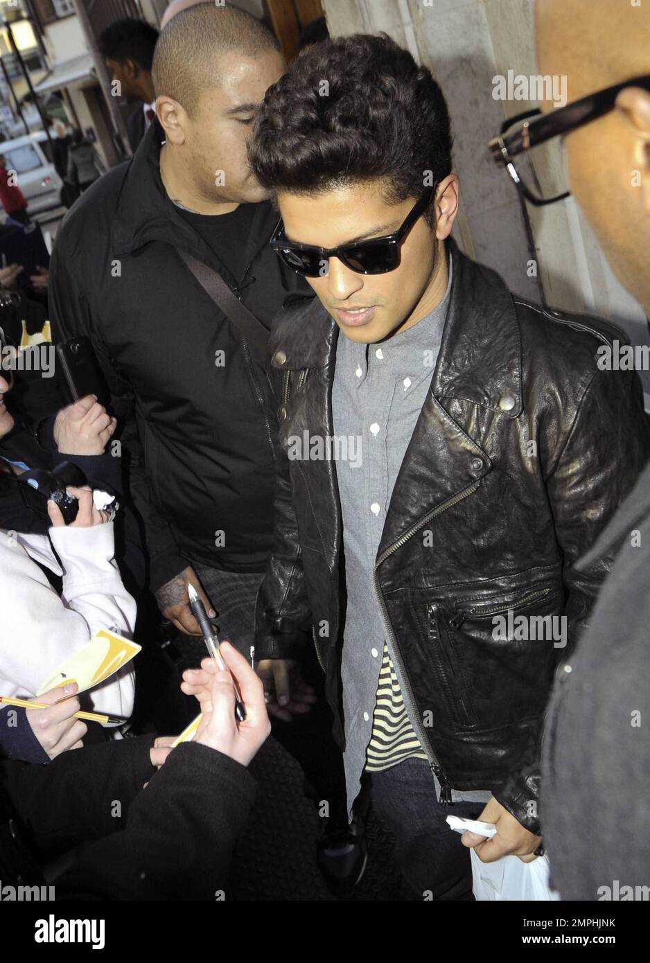 Singer/songwriter Bruno Mars (aka Peter Gene Hernandez) is mobbed by fans  and photographers as he leaves BBC Radio 1 after an appearance. Best known  for co-writing and vocals on "Nothin' on You"