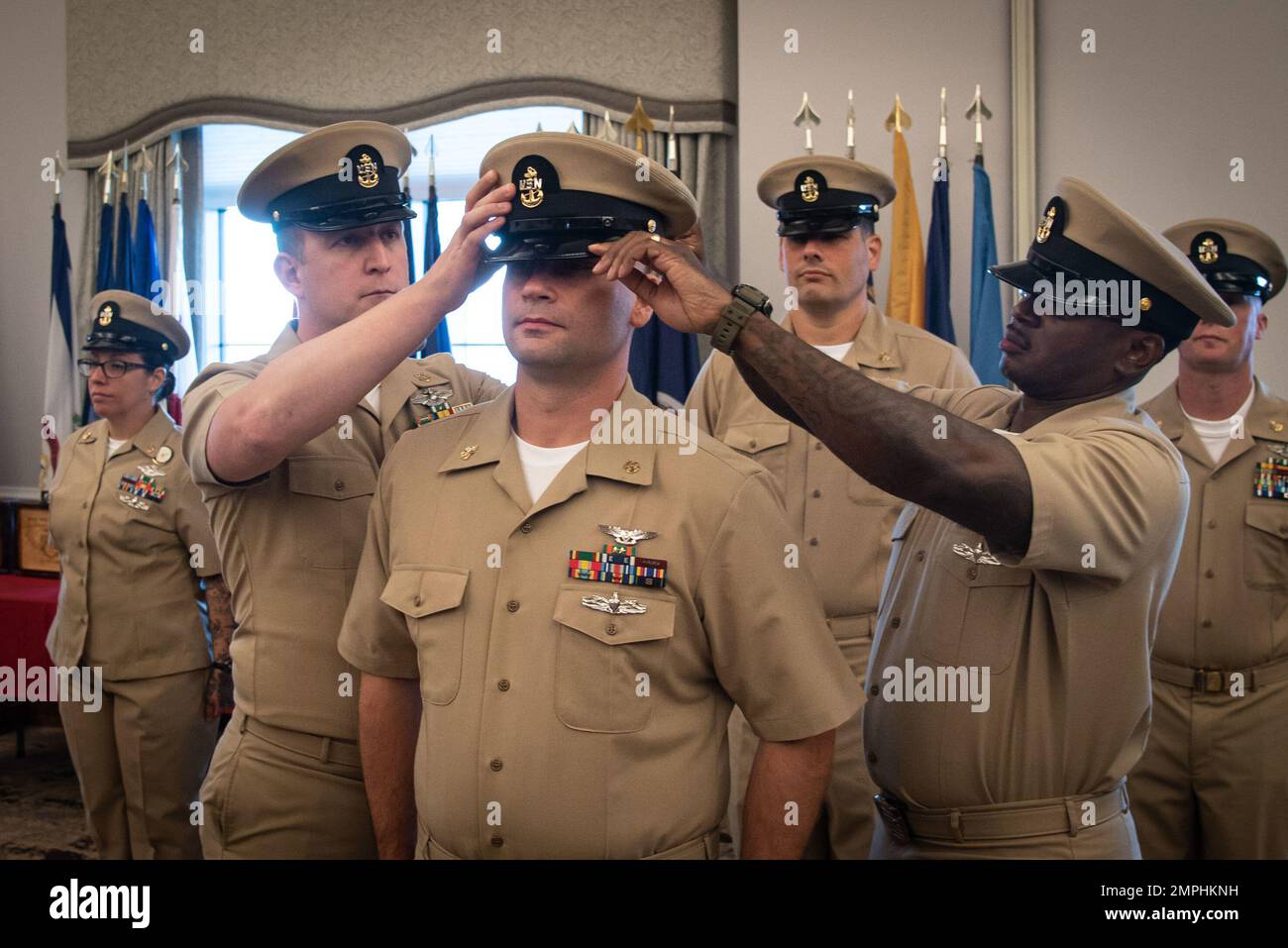 Chief Petty Officer Artan Maloku receives the Chief Petty Officer Khaki Combination Cap during her promotion ceremony Friday, October 21, 2022, aboard Marine Corps Air Station Cherry Point.  Maloku and four other sailors advanced to the rank of “Chief” during the ceremony. Stock Photo