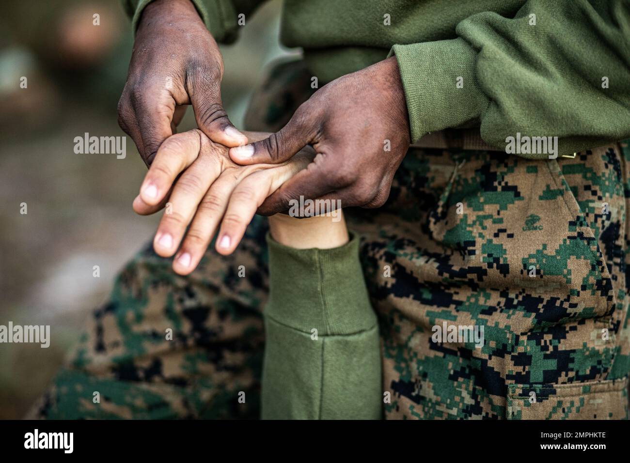 A recruit from Mike Company, 3rd Recruit Training Battalion, applies a choke  hold during a Marine Corps Martial Arts Program test at Marine Corps  Recruit Depot San Diego, July 20. The recruits