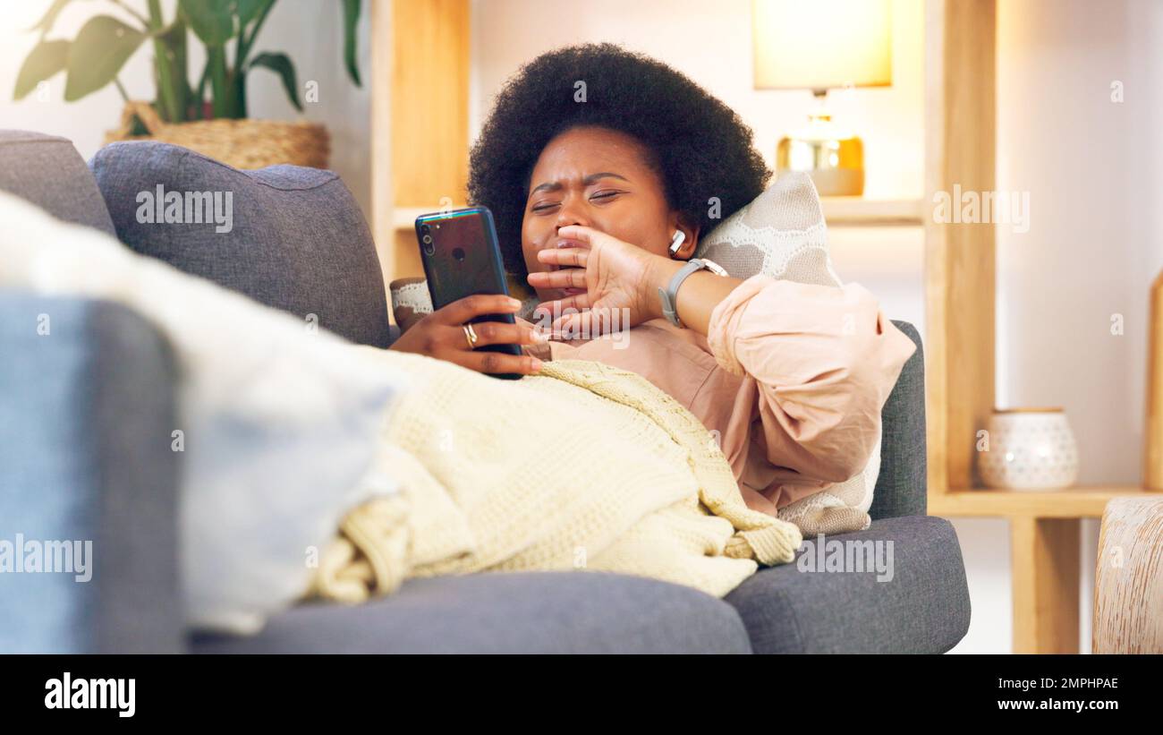 Woman yawing sofa hi-res stock photography and images - Alamy