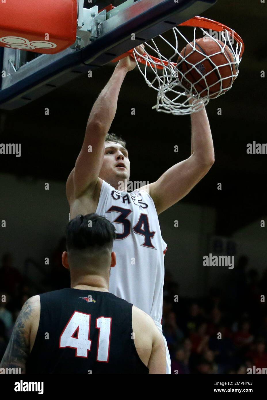 Saint Mary's Jock Landale (34) scores over Seattle's Aaron Menzies (41