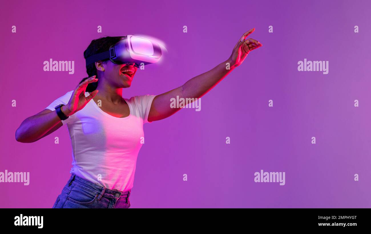 Excited Black Woman Wearing VR Headset Experiencing Virtual Reality In ...