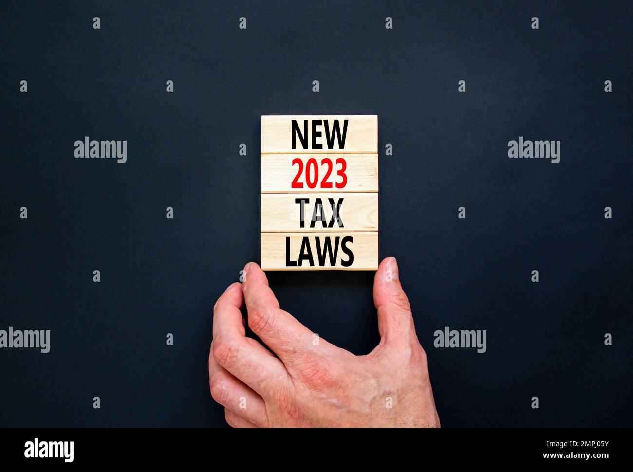 New 2023 tax laws symbol. Concept words New 2023 tax laws on wooden