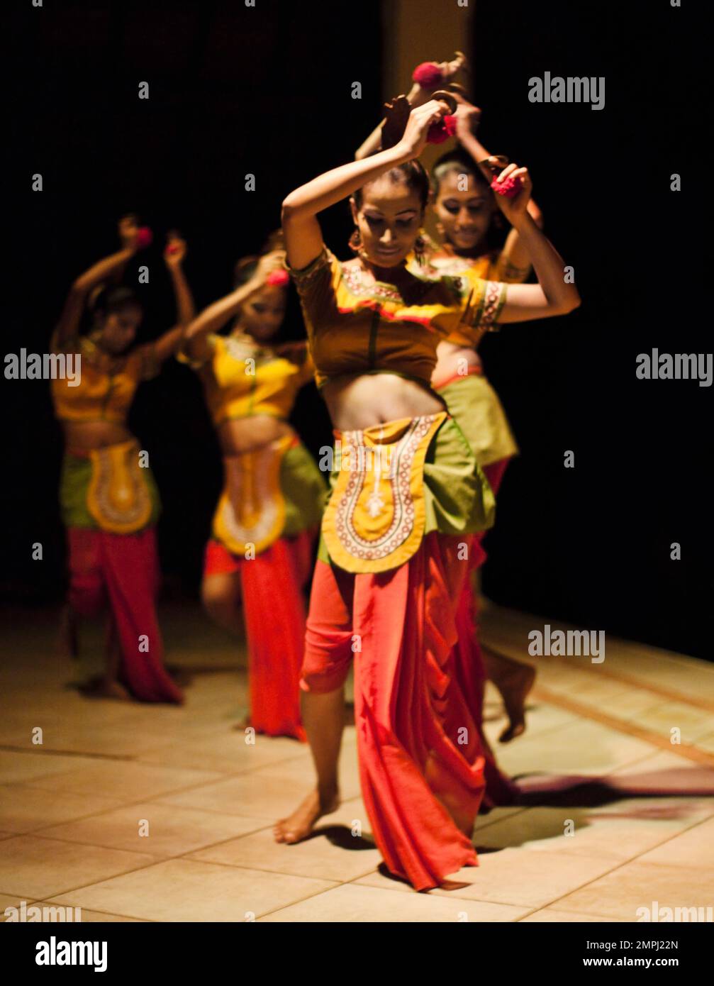 Traditional dancers perform at a Sri Lankan resort. Bentota, Sri Lanka ...