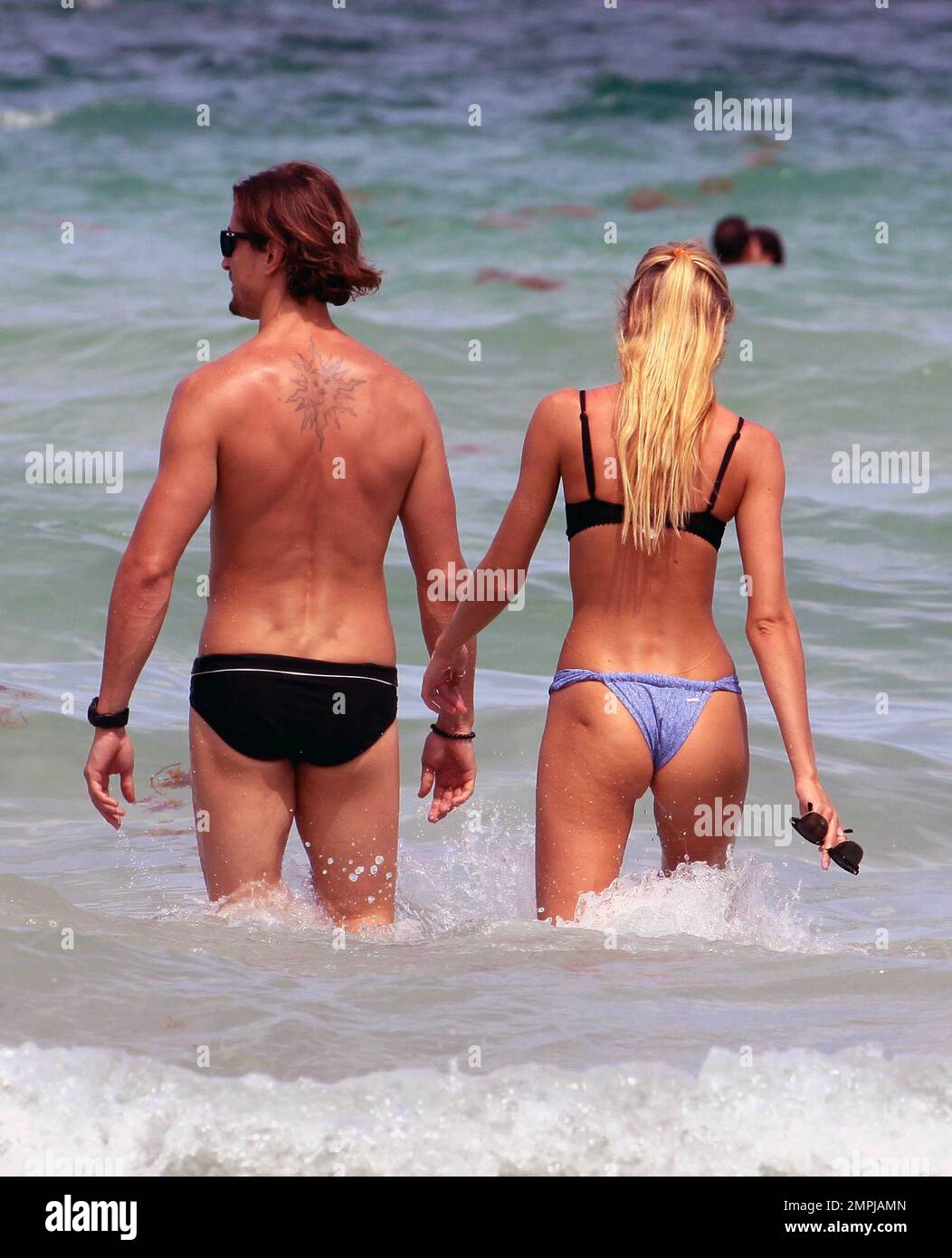 Victorias Secret supermodel Candice Swanepoel spends the Fourth of July holiday on the beach with her boyfriend Hermann Nicoli and friends