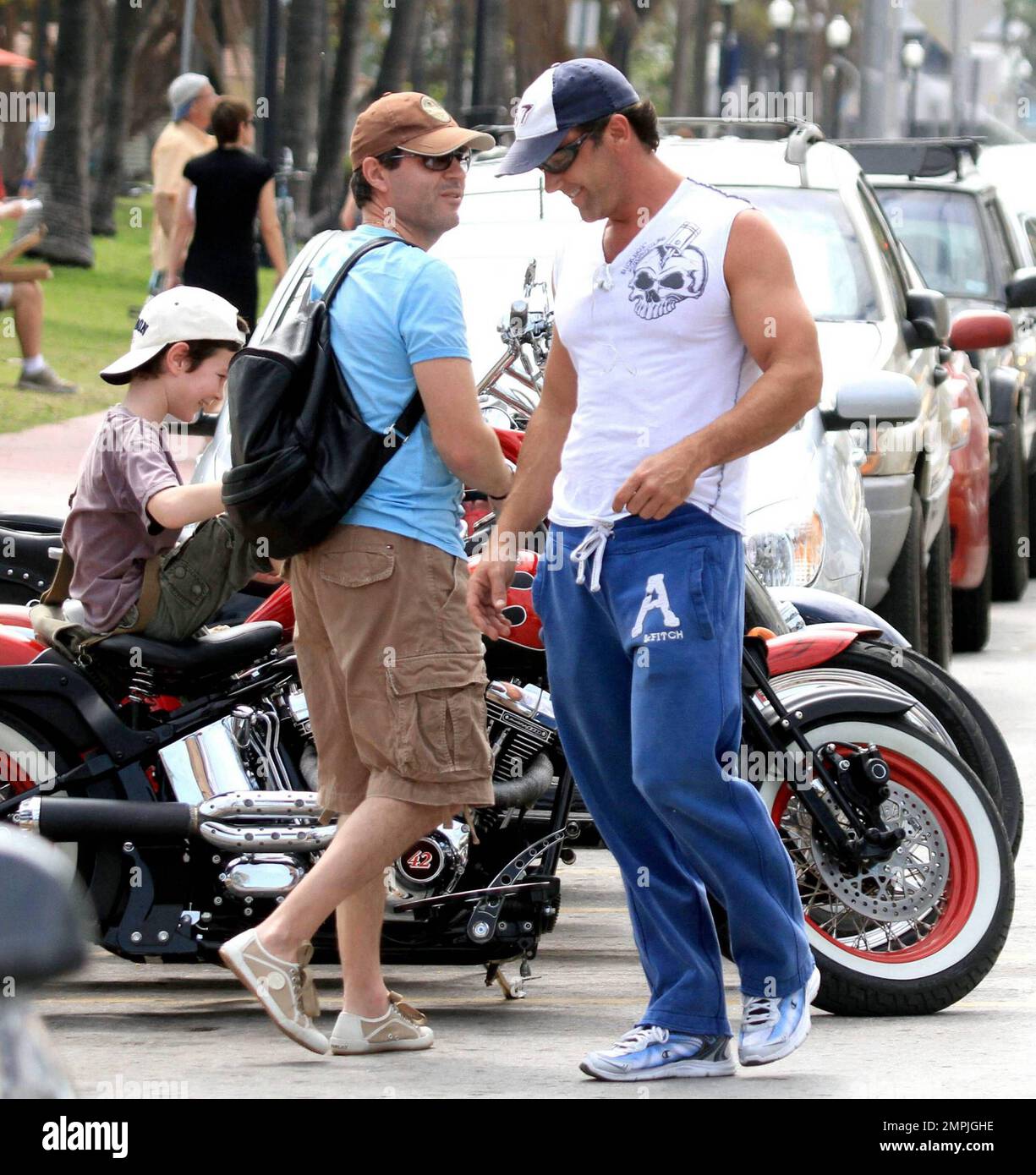 In his sweatpants and a sleeveless shirt Puerto Rican actor, singer and TV  personality Carlos Ponce takes his motorcycle out for a spin in Miami Beach  while listening to some tunes on