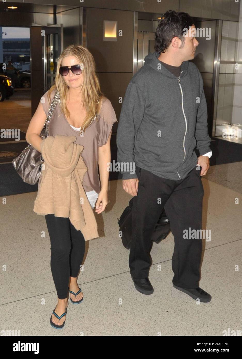kort vokal Tilfældig Actress and former Playboy model Carmen Electra makes her way through Miami  International Airport with fiance Rob Patterson. The couple were in town  for the weekend to celebrate Carmen's 38th birthday. Miami,