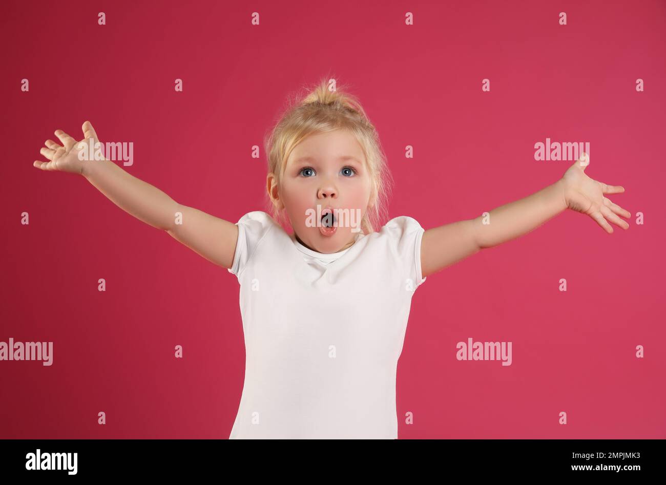 Portrait of emotional little girl on pink background Stock Photo - Alamy