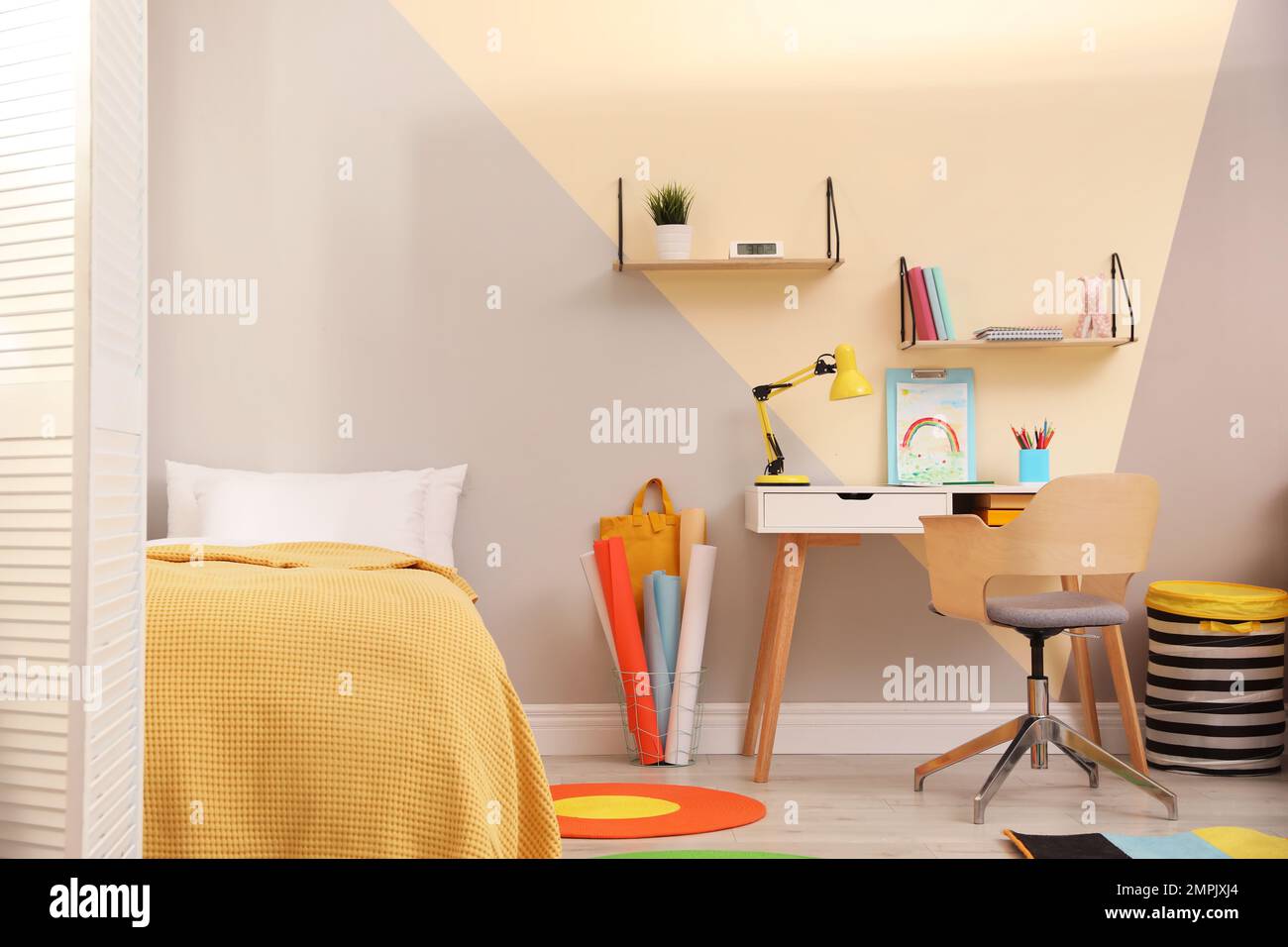 Stylish child room interior with comfortable bed and desk Stock Photo ...