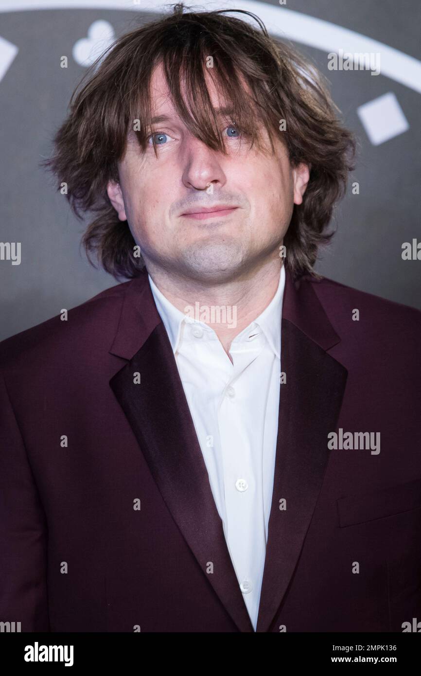 Composer Daniel Pemberton poses for photographers upon arrival at the