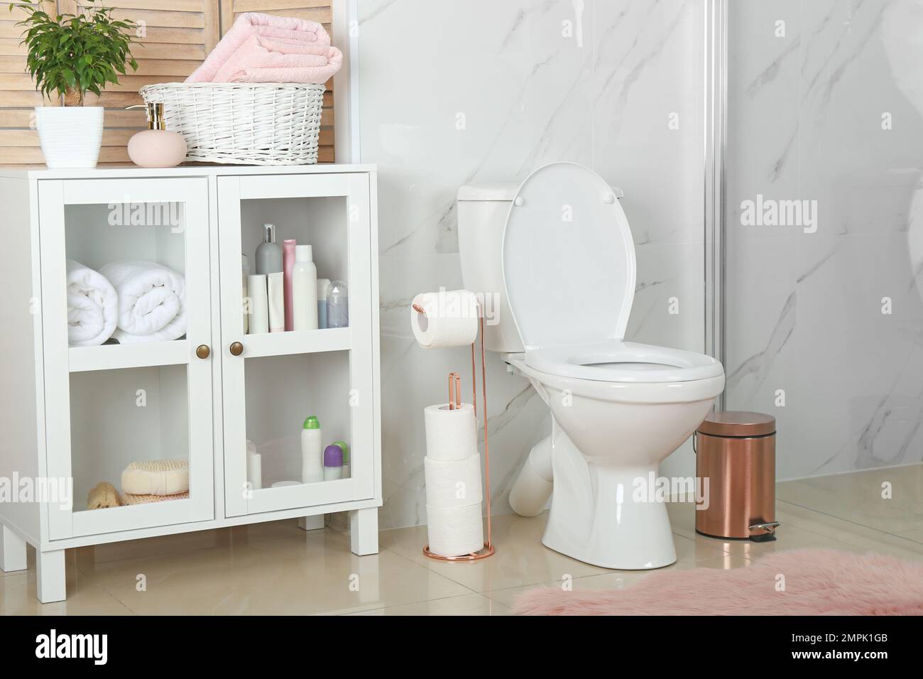 Stylish toilet bowl in modern bathroom interior Stock Photo - Alamy