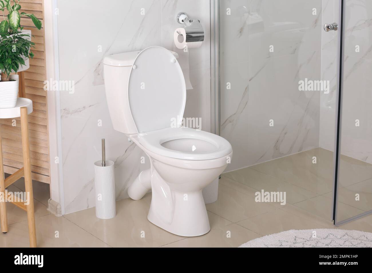 Stylish toilet bowl in modern bathroom interior Stock Photo - Alamy