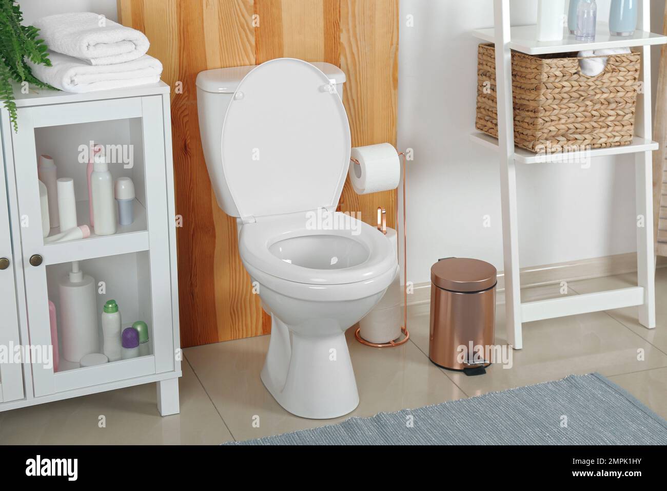 Stylish toilet bowl in modern bathroom interior Stock Photo - Alamy