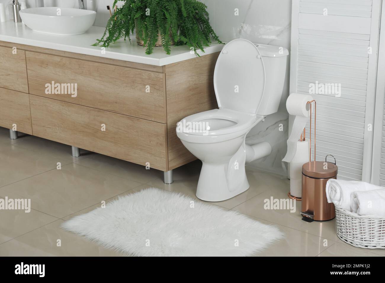 Stylish toilet bowl in modern bathroom interior Stock Photo - Alamy