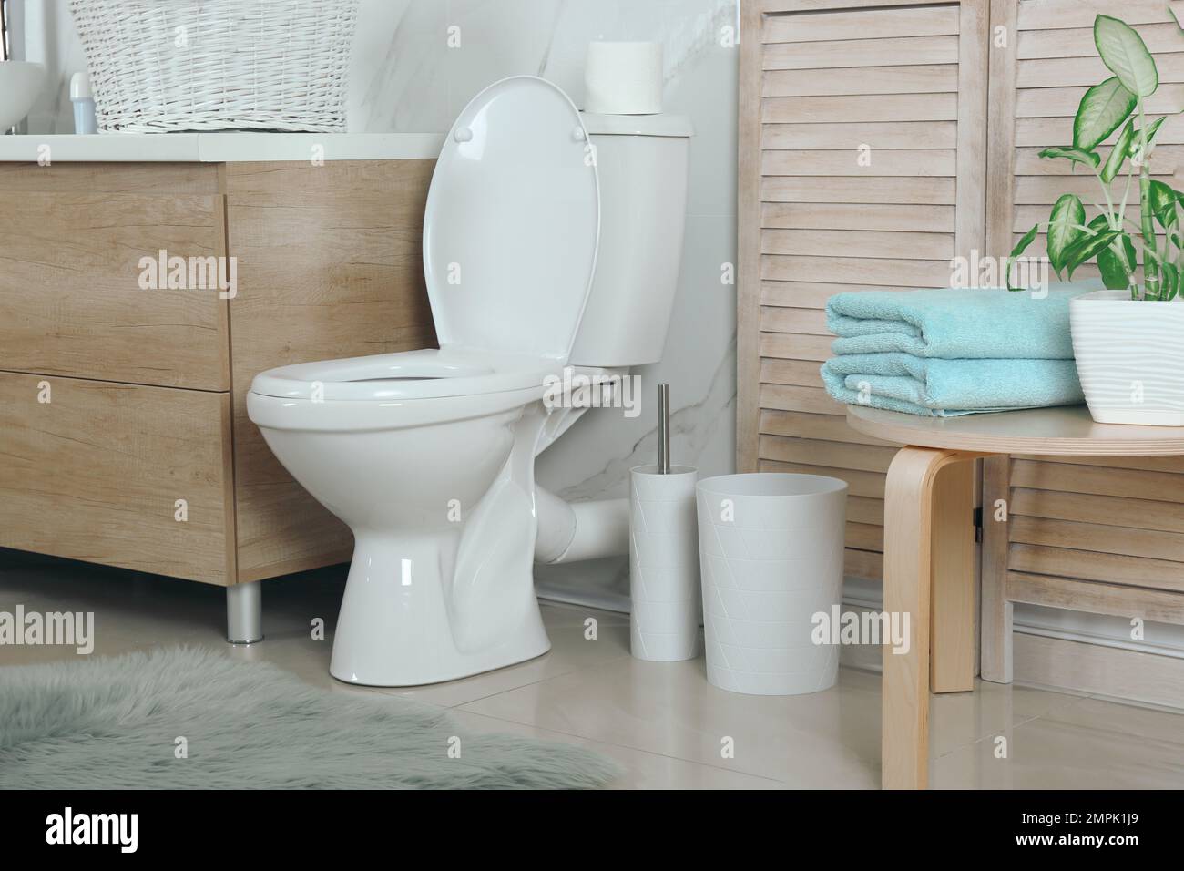 Stylish toilet bowl in modern bathroom interior Stock Photo - Alamy