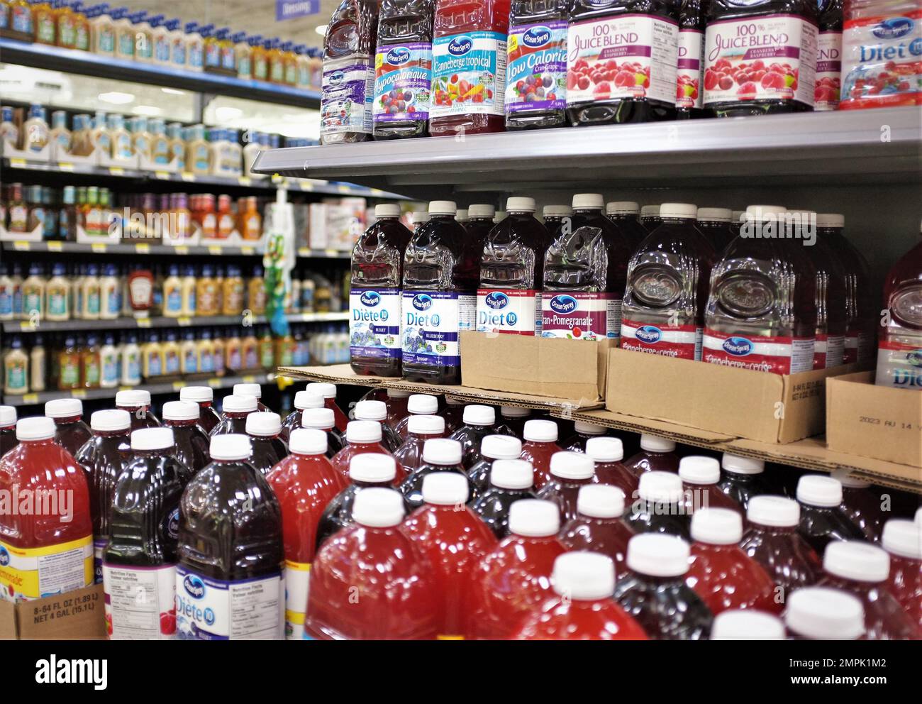 Juices bottles and canned food aisles at a Walmart store in Canada. Stock Photo