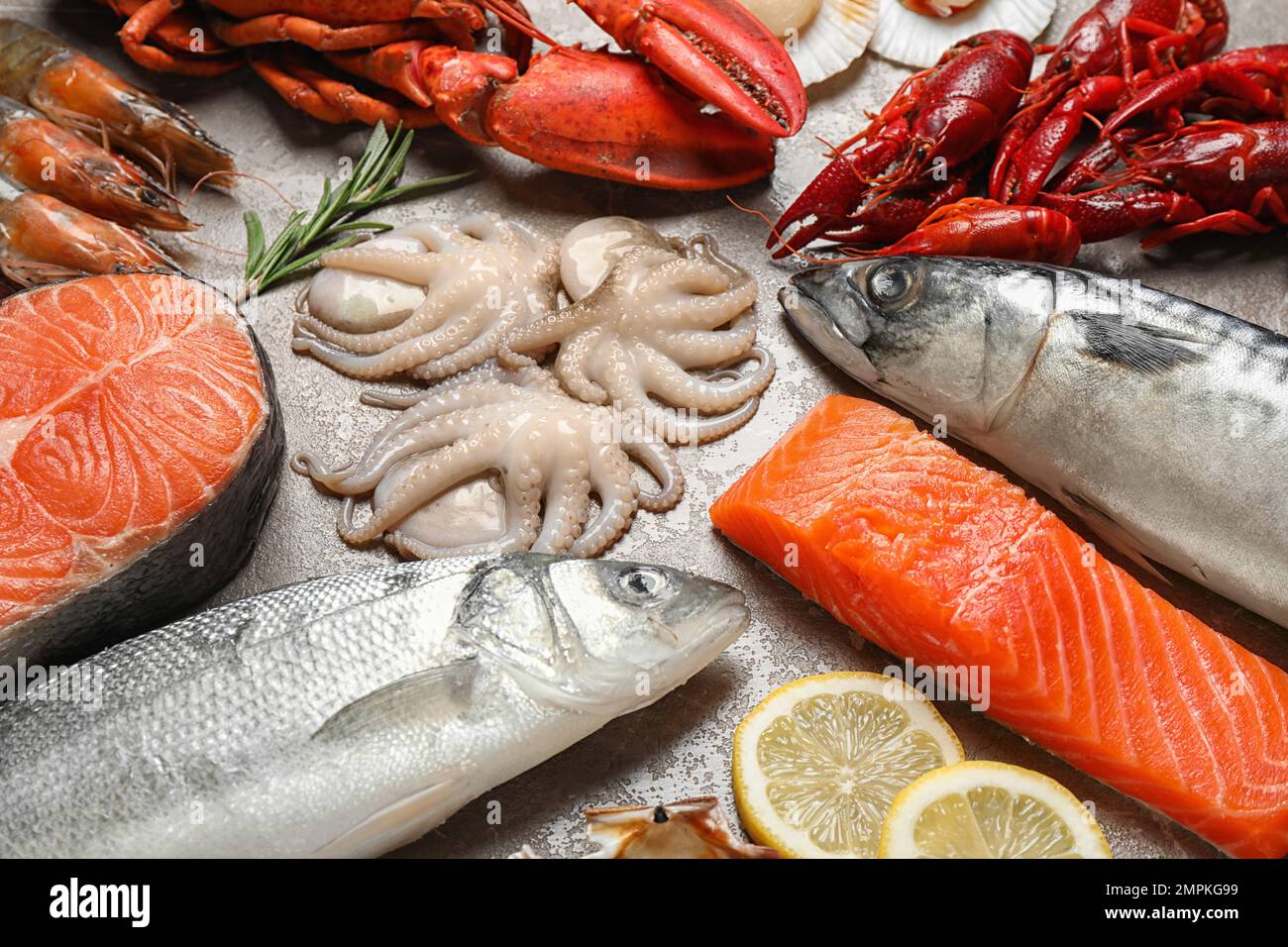 Fresh fish and seafood on marble table Stock Photo - Alamy