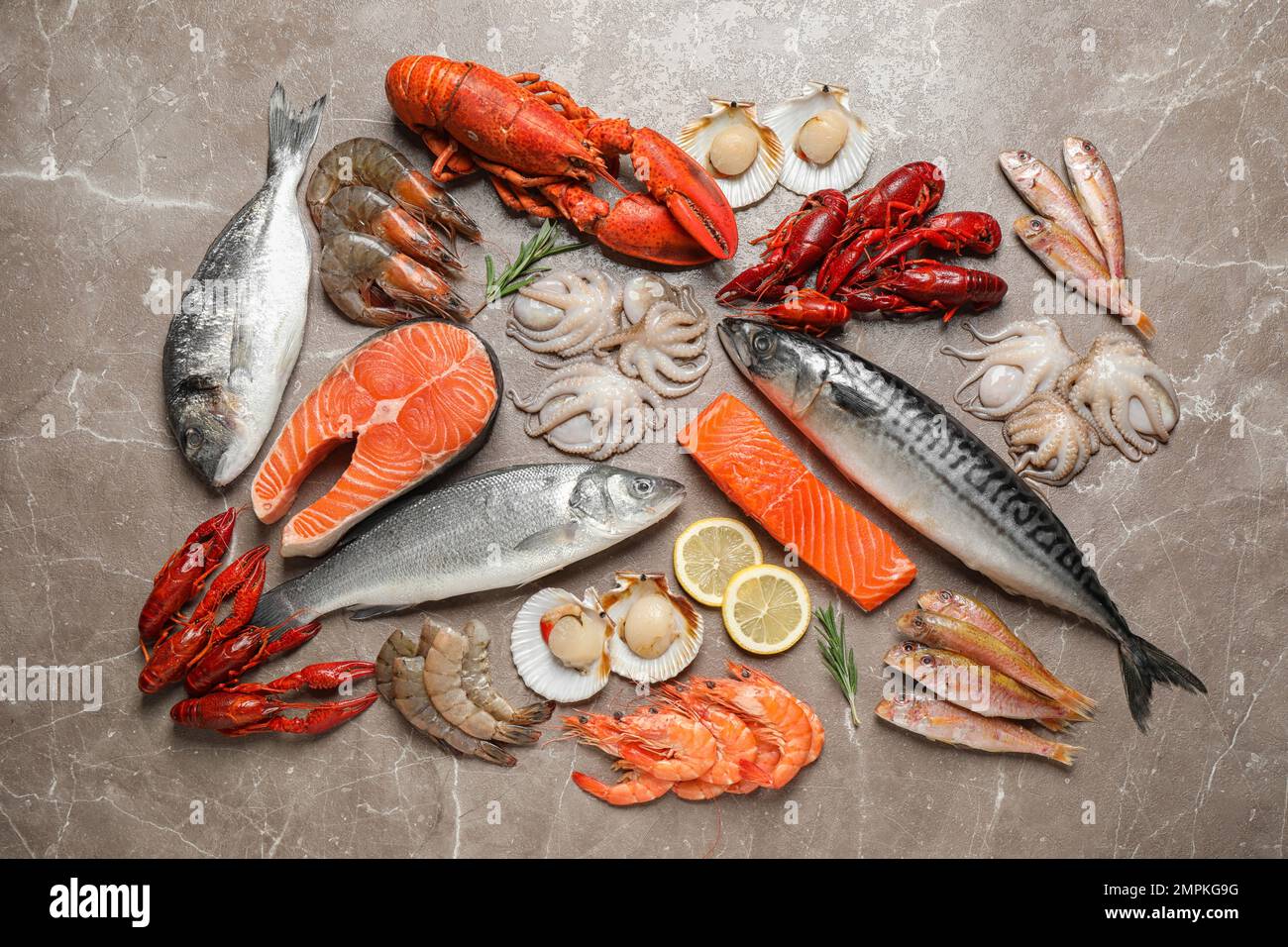 Fresh fish and seafood on marble table, flat lay Stock Photo - Alamy