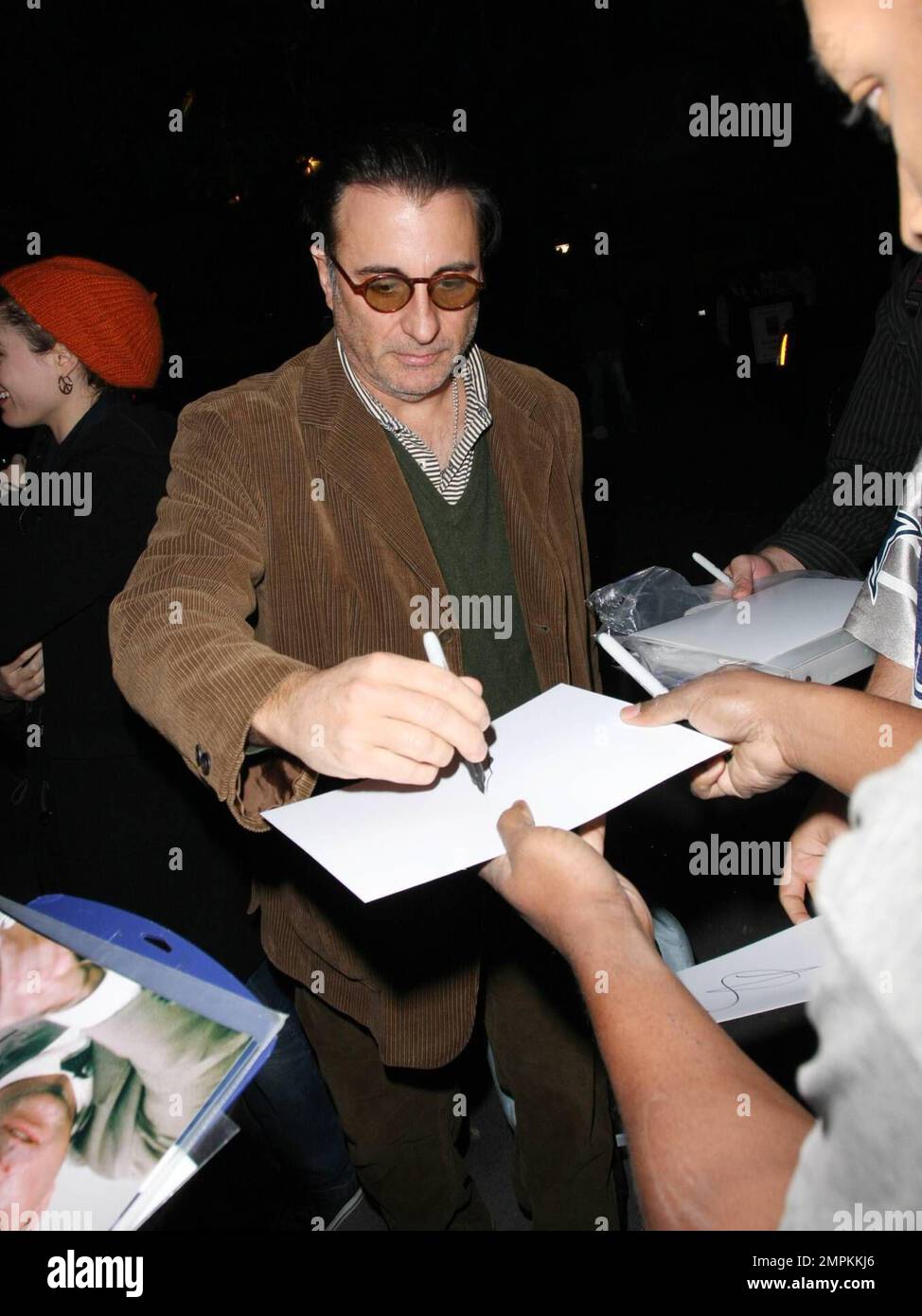 Exclusive!! Actor Andy Garcia arrives at the Staples Center to attend the Lakers Game and stops to sign autographs for fans. Los Angeles, CA. 1/20/09. Stock Photo